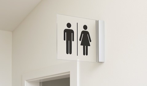 Pictogram bordje toiletten haaks op de wand